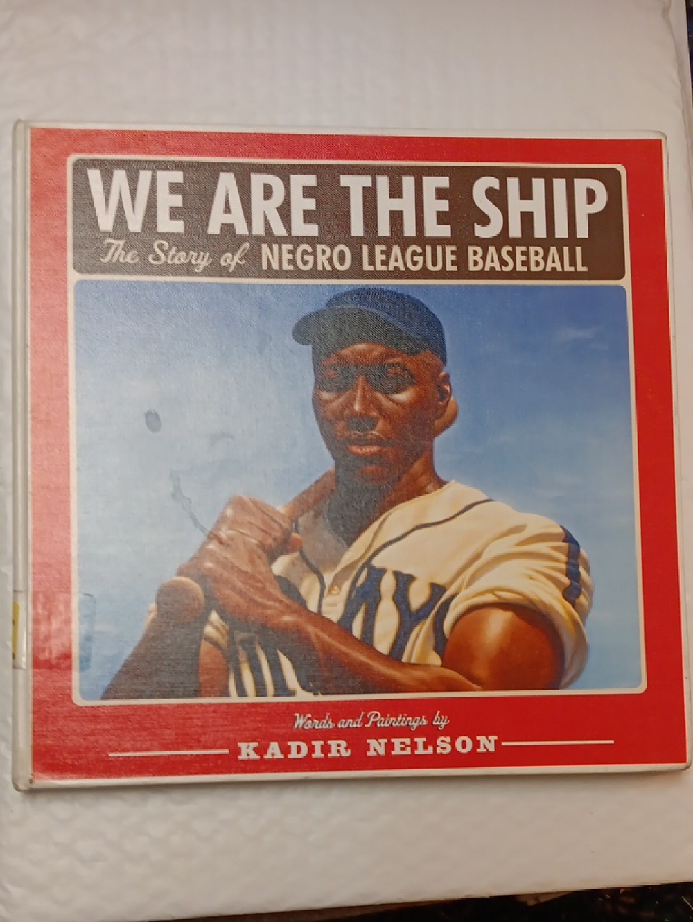 We Are The Ship - The Story of Negro League Baseball by Kadir Nelson - Red Cover